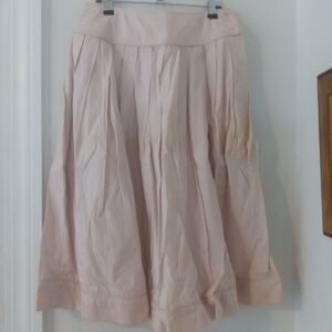 A side button up skirt from the 1980s that's pleated